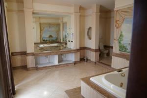 a large bathroom with a tub and a sink at Villa Princi in Villa San Giovanni +25 photos