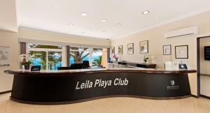 a lobby of a hotel with a reception desk at Macdonald Leila Playa Resort in La Cala de Mijas +37 photos