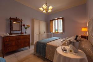 Posteľ alebo postele v izbe v ubytovaní Agriturismo Villa Ulivello in Chianti