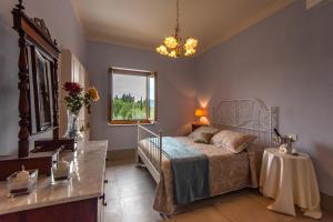 Posteľ alebo postele v izbe v ubytovaní Agriturismo Villa Ulivello in Chianti