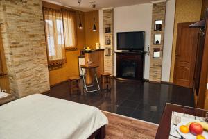 Televízia a/alebo spoločenská miestnosť v ubytovaní Africa Apartment