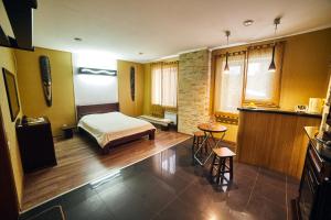 Posteľ alebo postele v izbe v ubytovaní Africa Apartment