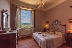 Posteľ alebo postele v izbe v ubytovaní Agriturismo Villa Ulivello in Chianti
