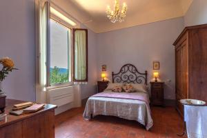 Posteľ alebo postele v izbe v ubytovaní Agriturismo Villa Ulivello in Chianti