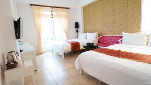 Postel nebo postele na pokoji v ubytování Sea Princess B&B