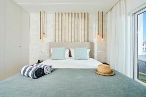 Un pat sau paturi într-o cameră la Areias Senses