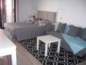 Ένα ή περισσότερα κρεβάτια σε δωμάτιο στο NC Apartamentos