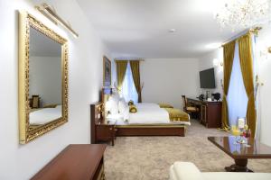 A bed or beds in a room at Integra Hotel