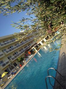 a view of a swimming pool in front of a hotel at Sunquest Gardens Holiday Resort in Limassol