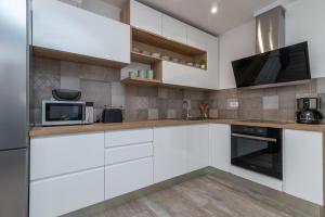 Kuchyň nebo kuchyňský kout v ubytování Apartment Ferias