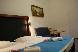 Postel nebo postele na pokoji v ubytování Hotel Garni Aaberna
