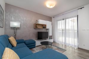 TV a/nebo společenská místnost v ubytování Apartment Ferias