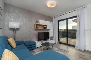 TV a/nebo společenská místnost v ubytování Apartment Ferias