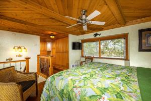 a bedroom with a bed and a ceiling fan at Penthouse Condo w/ Panoramic Ocean Views at Beach Resort in Oceanside +32 photos