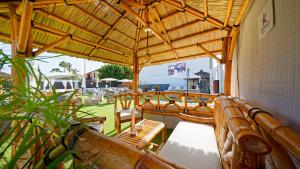 a porch with chairs and a wooden roof at FBC Fortuny Resort - Adults Only in Maspalomas