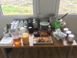 
a table topped with lots of different types of food at Hlid Bed and Breakfast in Myvatn
