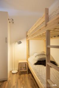 a bedroom with a bunk bed and a lamp at Actif 305 Apartment by Ål Ski Center in Ål