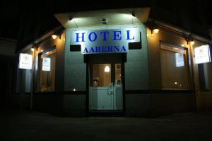 a building with a sign on the front of it at Hotel Garni Aaberna in Berlin