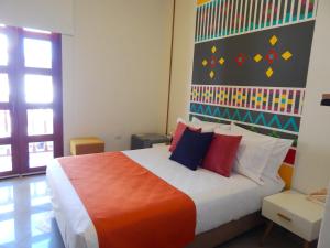 Postel nebo postele na pokoji v ubytování ETHNIC Thematic Hotel