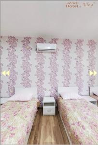 Voodi või voodid majutusasutuse Hotel Alley toas