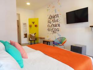 Postel nebo postele na pokoji v ubytování ETHNIC Thematic Hotel