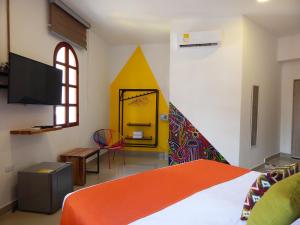 Postel nebo postele na pokoji v ubytování ETHNIC Thematic Hotel