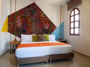 Postel nebo postele na pokoji v ubytování ETHNIC Thematic Hotel