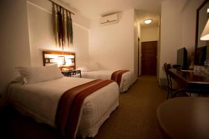 Postel nebo postele na pokoji v ubytování Tierra Viva Machu Picchu Hotel