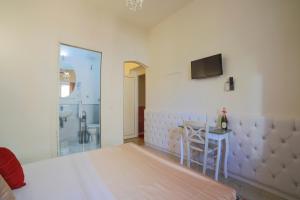 TV a/nebo společenská místnost v ubytování Villino Carmela SUITES