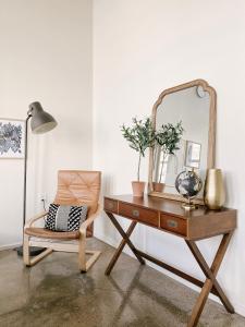 a dressing table with a mirror and a chair at Modern Loft w/ View in Knoxville