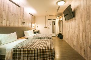 Postel nebo postele na pokoji v ubytování Hotel PaPa Whale