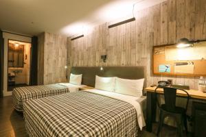 Postel nebo postele na pokoji v ubytování Hotel PaPa Whale