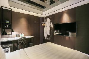 TV a/nebo společenská místnost v ubytování Hotel PaPa Whale