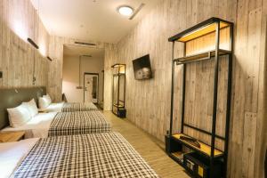 Postel nebo postele na pokoji v ubytování Hotel PaPa Whale