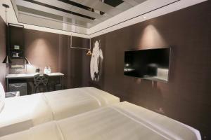 TV a/nebo společenská místnost v ubytování Hotel PaPa Whale