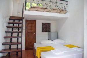Postel nebo postele na pokoji v ubytování Boracay Ocean Bay Hotel