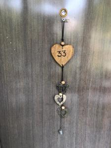 a heart shaped ornament hanging on a wall at Posthof 33 in Kitzbühel