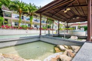 a swimming pool in the middle of a building at Butchard Villas in Yuchi