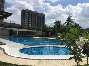 a large swimming pool in front of a building at Bamboo Bay Condominium near UC Med & Chong Hua Hospital, CDU School, SM Mall, Ayala Mall and IT Park - studio condo unit in Cebu City