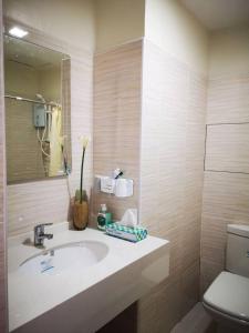 a bathroom with a sink and a toilet at Bamboo Bay Condominium near UC Med & Chong Hua Hospital, CDU School, SM Mall, Ayala Mall and IT Park - studio condo unit in Cebu City