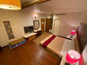 TV a/nebo společenská místnost v ubytování Dong Zhi Gang Motel