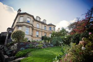a large house with a garden in front of it at Grays Boutique B&B in Bath