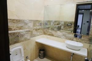 Koupelna v ubytování Amora Rooms Dwarka
