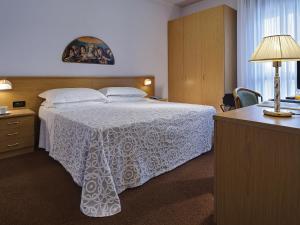Postel nebo postele na pokoji v ubytování Hotel Terme Marco Polo
