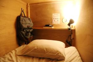 Postel nebo postele na pokoji v ubytování Y Pub & Hostel Tottori