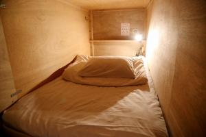 Postel nebo postele na pokoji v ubytování Y Pub & Hostel Tottori