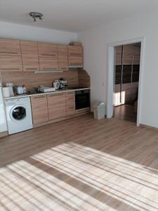 A kitchen or kitchenette at Ádám Guesthouse I.