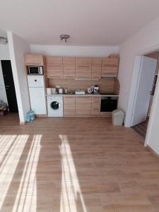 A kitchen or kitchenette at Ádám Guesthouse I.