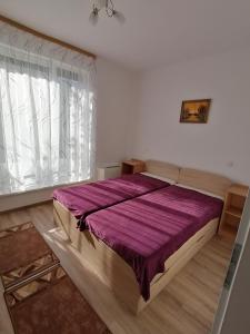 Ένα ή περισσότερα κρεβάτια σε δωμάτιο στο Ádám Guesthouse I.
