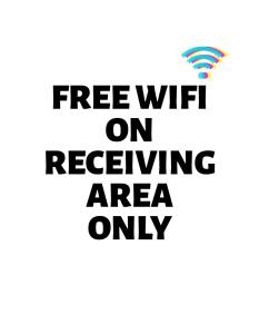 a sign that says free wifi on redeeming area only at Zaniya's Pension in El Nido